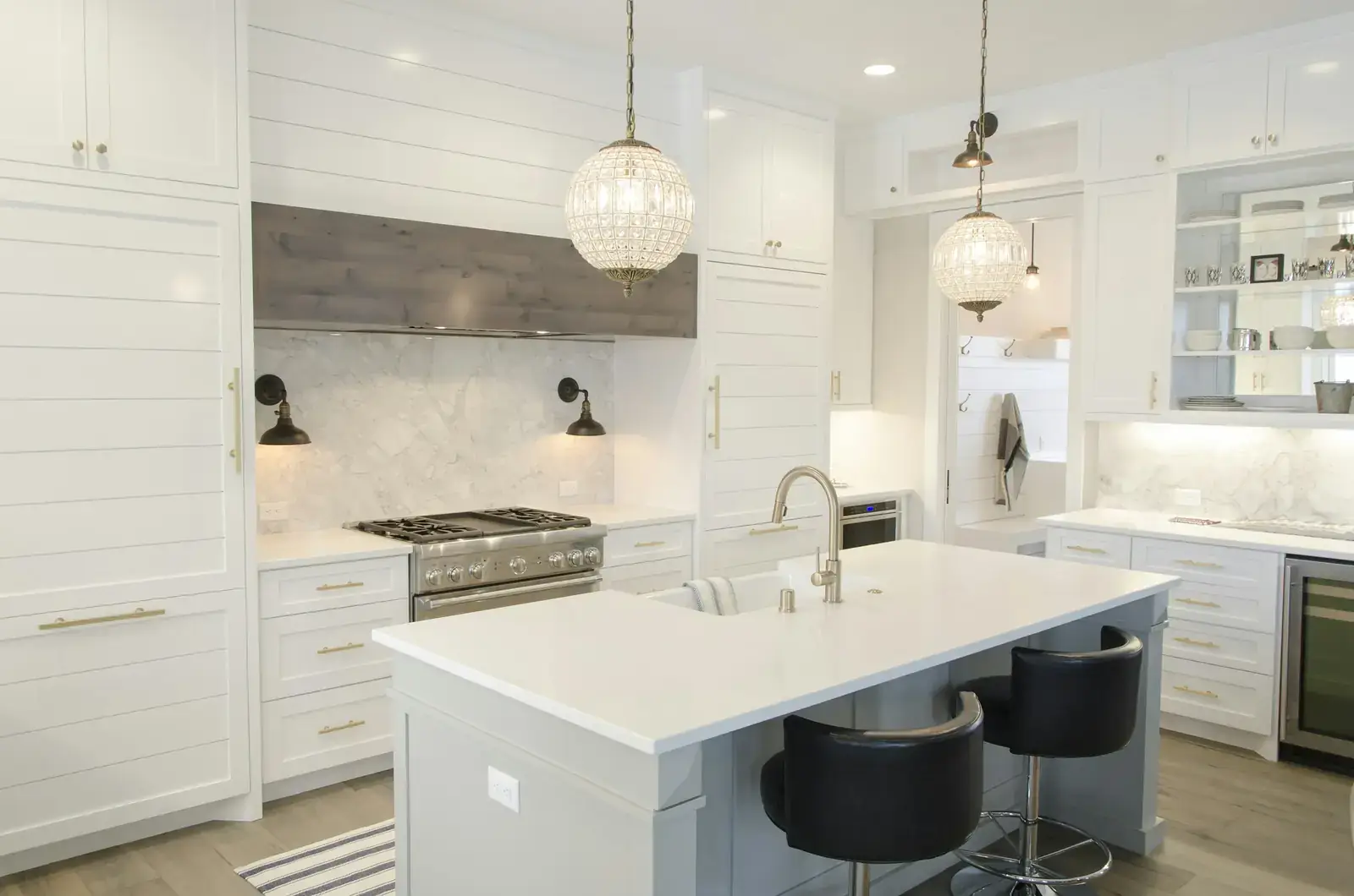 Kitchen pendant lights over a marble island